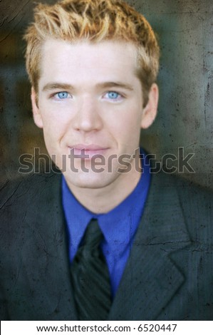 Close-up portrait of one blond hair blue eye business man with full suit