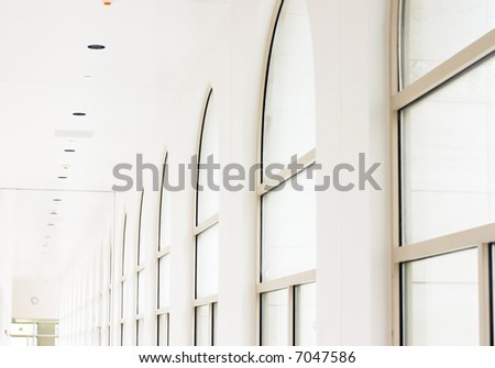 bright white diminishing perspective of corridor with windows