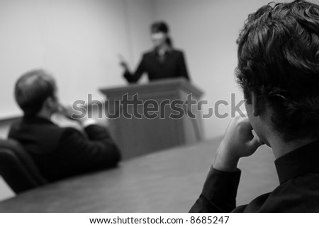 Business People in a meeting with a Business Woman leading