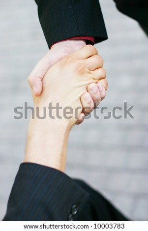 close up of handshake between two businessmen