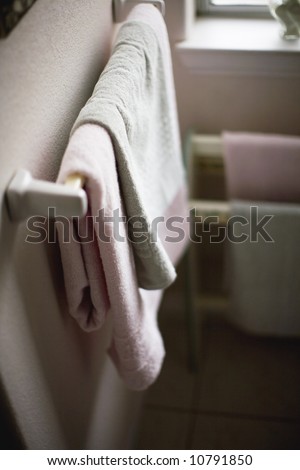 Closeup of bathroom towels hanging on rack