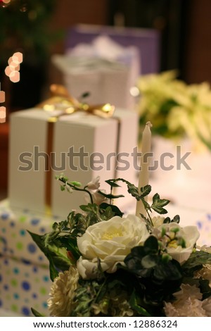 arrangement of wedding gifts with flowers and lights