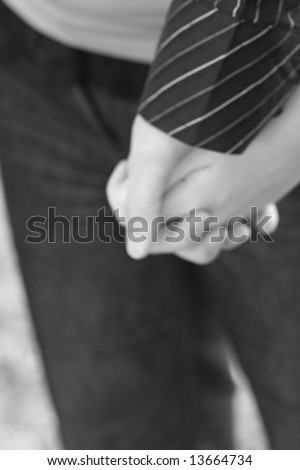 stock photo : black and white close up of couple holding hands