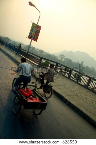 People on bikes going to work in China