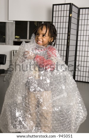 Child wrapped in bubble wrap packaging