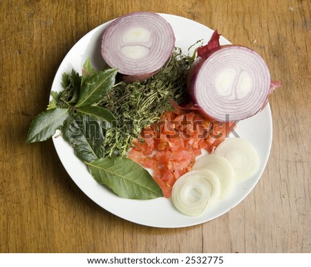 Herbs, diced tomato and onions on a plate