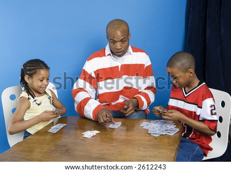 Family playing a card game