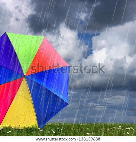 rainbow colored umbrella\'s in heavy rain to use as background