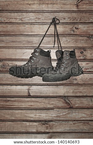 old boots hanging on a nail