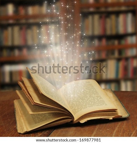 Opened magic book with magic light