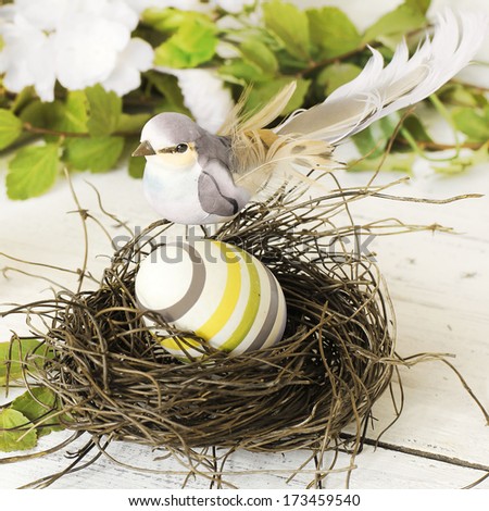 Easter decoration: bird and egg in a nest