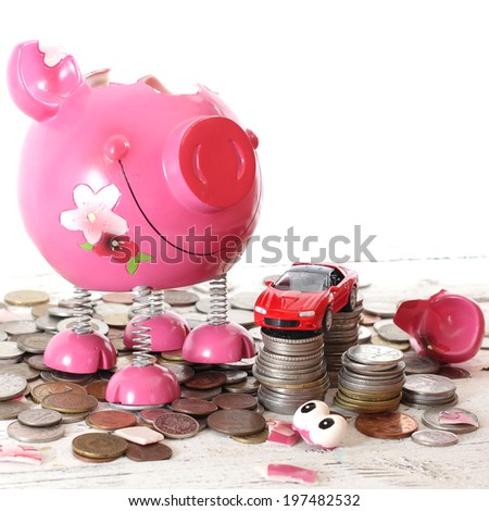 Broken piggy bank filled with loose change