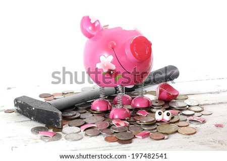 Broken piggy bank filled with loose change
