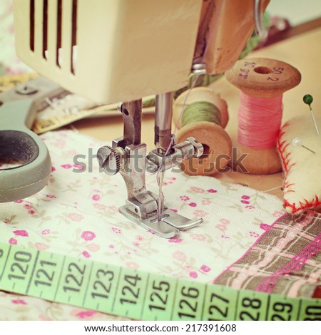 sewing machine, dressmaker scissors and thread-style retro