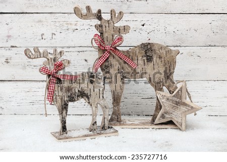 Christmas Reindeer on wooden background in scandinavian style