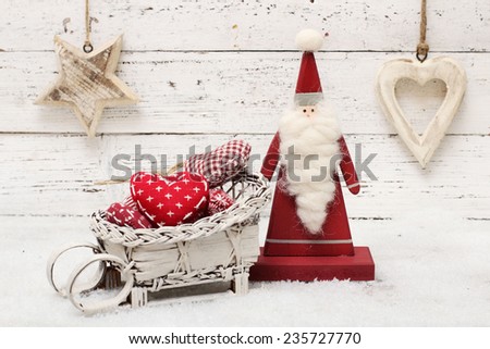 Santa Claus and christmas decoration on wooden background in scandinavian style