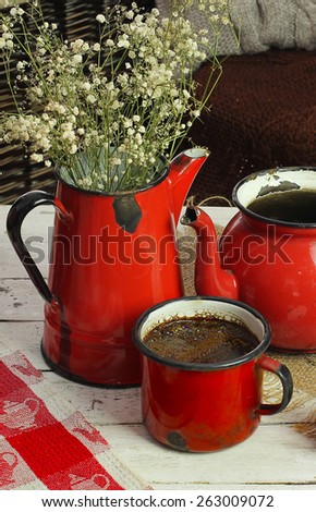 cup of coffee and jugs in the old style