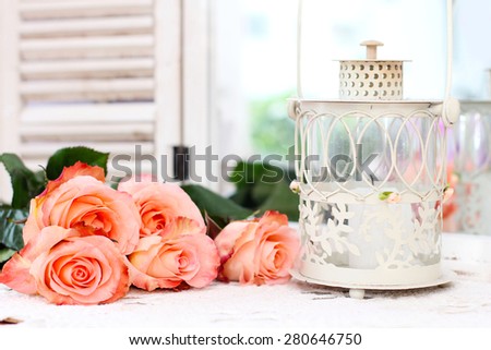 Beautiful bouquet of peach roses in shabby style on a mirror background