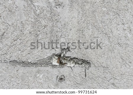 Grain grey paint wall with hole background or texture