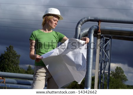 Woman engineer or architect with white safety hat, drawings and industrial pipelines on background
