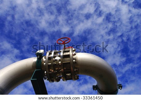 industrial pipelines on pipe-bridge against blue sky