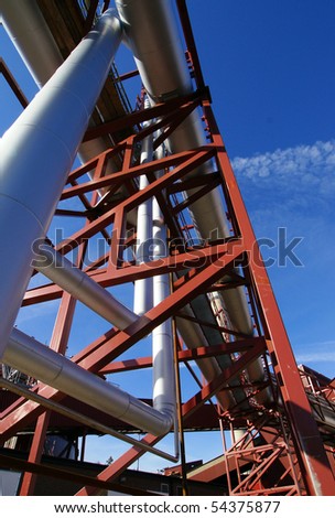 Industrial zone, Steel pipelines and support structures on blue sky