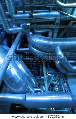 Industrial zone, installation of Steel pipelines and cables in blue tones
