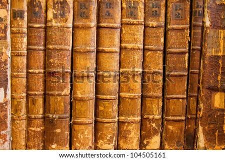 A background collection of rare volumes of Scottish Parliamentary Acts dating around 1424 through 1651. Distressed condition.