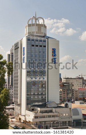 KIEV, UKRAINE - AUGUST 07: Workers are working on the roof of Hotel Park Inn by Radisson on Trinity Square on August 07, 2013 in Kiev, Ukraine. The Hotel is located in front of Olympic Stadium arena.