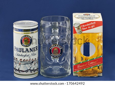 KIEV, UKRAINE - MAY 06, 2012: Paulaner Octoberfest Bier one litre can, mug and limited edition box against blue background. Paulaner is a German brewery established in the early 17th century in Munich