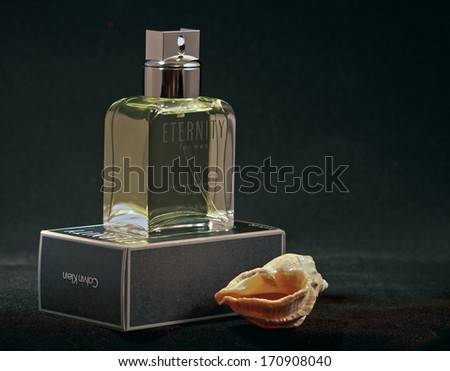 KIEV, UKRAINE - FEBRUARY 15, 2011: Calvin Klein Eternity fragrance for men bottle and pack against black background. Eternity for men fragrance was created by Carlos Benaim and was launched in 1989.