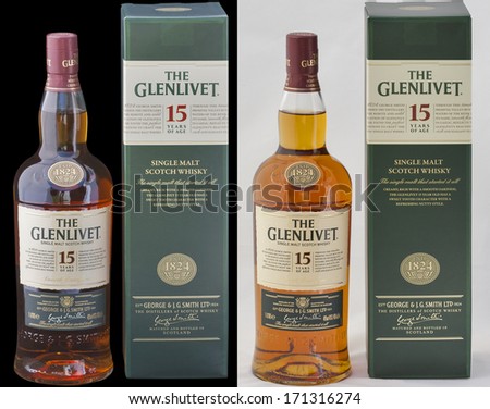KIEV, UKRAINE - AUGUST 26, 2012: Bottle and box of The Glenlivet single malt Scotch whisky 15 years of age on black and white. Founded 1824 now it is the biggest selling single malt whisky in the US.