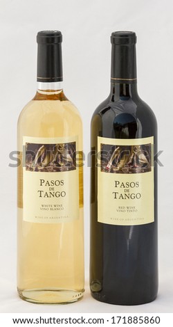 KIEV, UKRAINE - AUGUST 26, 2012: Bottles of Argentinean wine Pasos de Tango white and red on white. Argentine wine industry is the fifth largest producer of wine in the world has its roots in Spain.