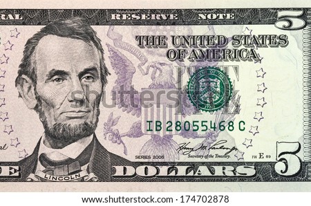 Portrait of Lincoln from five dollars bill new edition macro