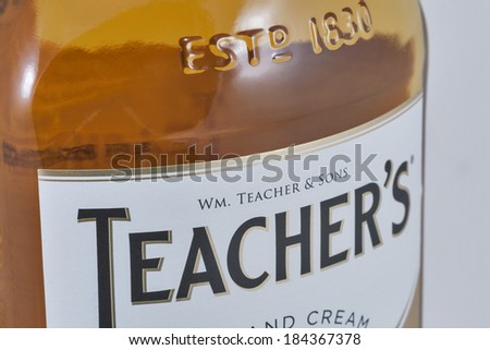 KIEV, UKRAINE - FEBRUARY 02, 2014: Teacher\'s Highland Cream Scotch whisky bottle label macro isolated on white. Teacher\'s Highland Cream is a brand of blended scotch whisky produced in Glasgow.