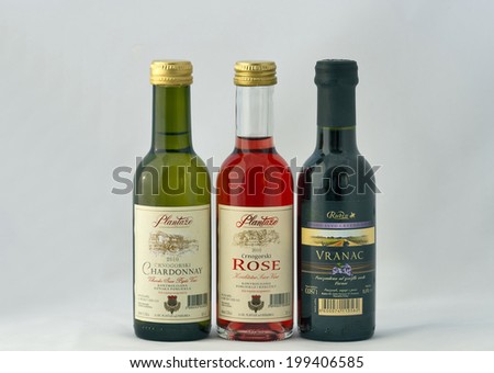 KIEV, UKRAINE - JULY 09, 2011: Montenegro small wine bottles Rubin Vranac, Plantaze Chardonnay and Rose on white. Many Montenegrin vineyards are located in southern and coastal regions of the country.
