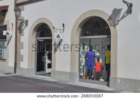 MUGELLO, ITALY - SEPTEMBER 11, 2014: Facade of Adidas store in McArthurGlen Designer Outlet Barberino close to Florence. Adidas AG is a German multinational corporation founded 1949 by Adolf Dassler.