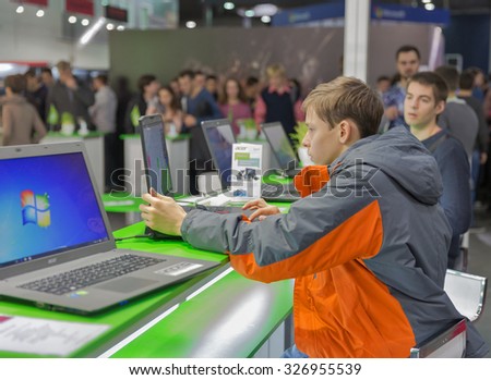 KIEV, UKRAINE - OCTOBER 11, 2015: People visit Acer, a Taiwan based international computer company booth during CEE 2015, the largest electronics trade show of Ukraine in ExpoPlaza Exhibition Center.