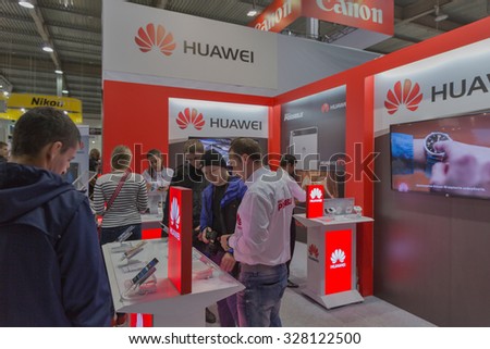 KIEV, UKRAINE - OCTOBER 11, 2015: People visit Huawei, Chinese  electronics manufacturer company booth during CEE 2015, the largest electronics trade show of Ukraine in ExpoPlaza Exhibition Center
