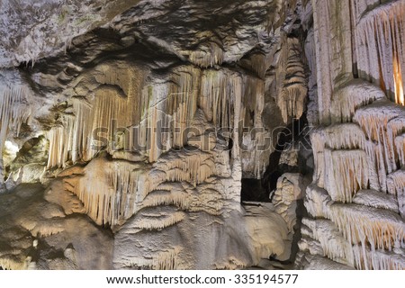 Formations inside cave with stalactites and stalagmites. Postojna cave, Slovenia.