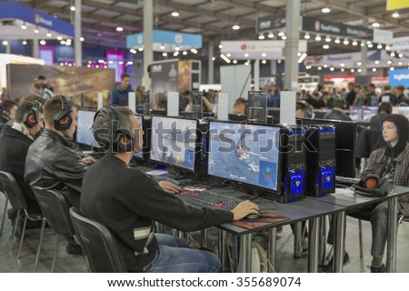 KIEV, UKRAINE - OCTOBER 11, 2015: People visit Wargaming company computer game zone during CEE 2015, the largest electronics trade show of Ukraine in ExpoPlaza Exhibition Center.