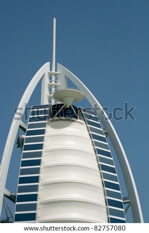 DUBAI, UNITED ARAB EMIRATES - MAY 19: Burj Al Arab luxury hotel with circle helicopter pad on top of building on May 19, 2011 in Dubai, UAE. Helipad can be transformed to tennis or golf playground.