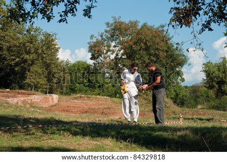 CERVAR PORAT, CROATIA - AUGUST 05: Two unidentified archaeologists do research in a Classical Roman Antiquity Lorun settlement of residential villa and ceramic workshop on August 05, 2011 in Cervar Porat, Croatia.