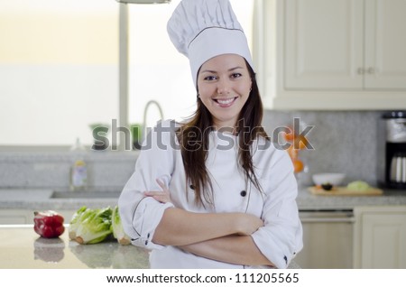 Cute latin chef welcoming people into her kitchen