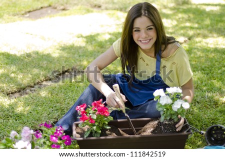 Cute latin gardener loving her job
