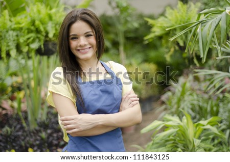 Latin business owner greeting customers in a nursery garden