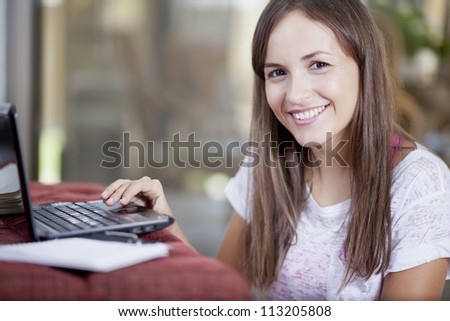 Happy young woman working from home