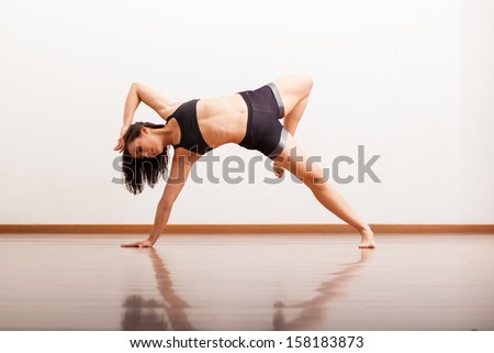 Beautiful female jazz dancer showing off in a dance studio