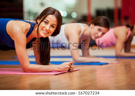 Happy Female Friends Exercising And Having Fun In A Gym Class