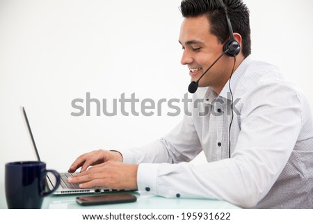 Customer service representative taking a call from a customer and smiling
